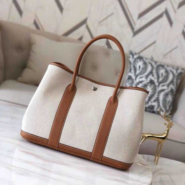 classic garden party tote bag canvas with layer cowhide women's bag garden 2023 new handbag leather contrast single shoulder crossbody
classic garden party tote bag canvas with layer cowhide women's bag garden 2023 new handbag leather contrast single shoulder crossbody