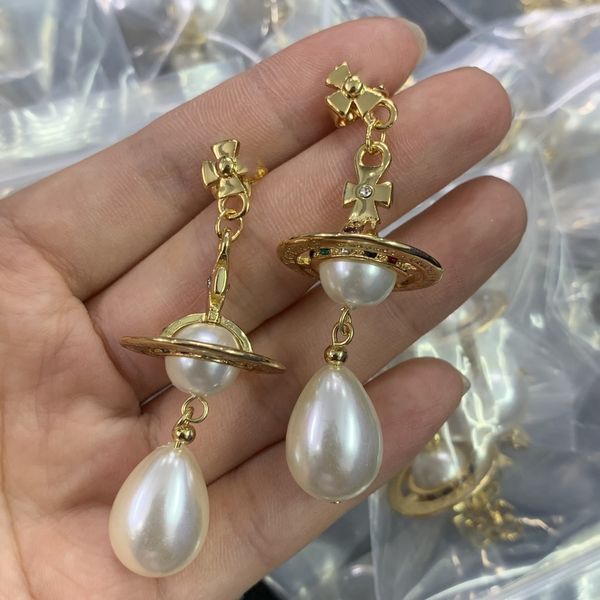 woman stud designer earrings gold hoop earing vivian orecchini luxury women pearl saturn earings jewelry westwood 3978, Golden;silver
woman stud designer earrings gold hoop earing vivian orecchini luxury women pearl saturn earings jewelry westwood 3978, Golden;silver