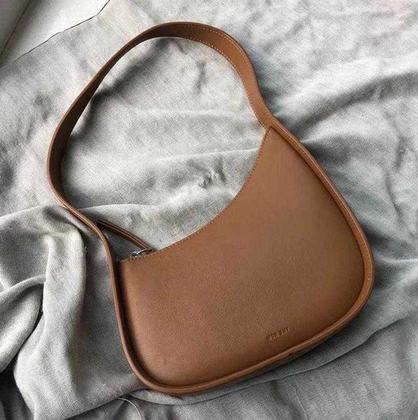 the row half moon shoulder bag design genuine leather women flat shoulder strap suded lining underarm tote bag light luxury and high sense
the row half moon shoulder bag design genuine leather women flat shoulder strap suded lining underarm tote bag light luxury and high sense