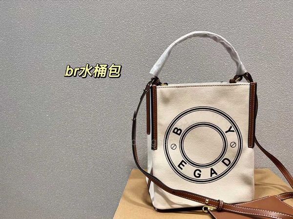 burberr designer bags summer style large capacity canvas bucket bag for girls one shoulder crossbody carrying bag the same model
burberr designer bags summer style large capacity canvas bucket bag for girls one shoulder crossbody carrying bag the same model
