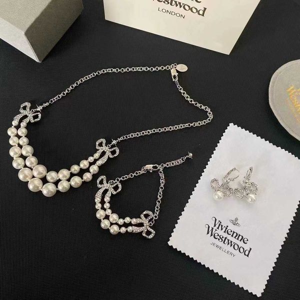 western empress dowager double pearl diamond bowknot vivienne saturn necklace bracelet earrings, Silver
western empress dowager double pearl diamond bowknot vivienne saturn necklace bracelet earrings, Silver