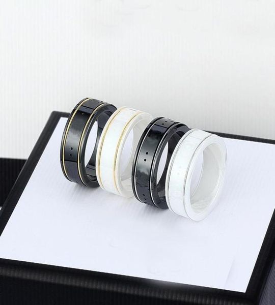 dhl ceramic band rings black white for women men jewelry gold silver ring 4 colors1801472
dhl ceramic band rings black white for women men jewelry gold silver ring 4 colors1801472