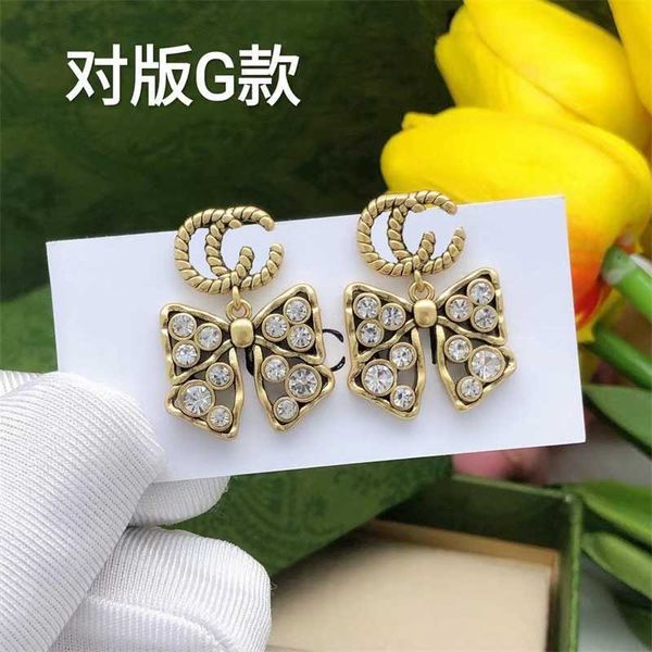 made of old diamond inlaid bow knot ancient earrings light luxury fashion classic small design double, Silver
made of old diamond inlaid bow knot ancient earrings light luxury fashion classic small design double, Silver