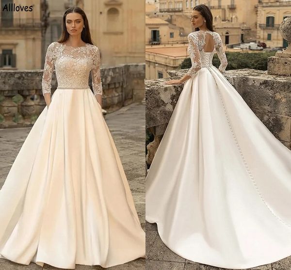 jewel neck lace a line wedding dresses with pocket 3/4 long sleeves hole back modern satin bridal gowns plus size court train reception part, White
jewel neck lace a line wedding dresses with pocket 3/4 long sleeves hole back modern satin bridal gowns plus size court train reception part, White