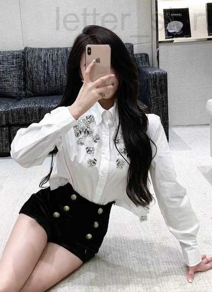 women's polos designer 23ss spring and summer niche water diamonds with heavy craftsmanship, fashionable white shirt, sweet temperament
women's polos designer 23ss spring and summer niche water diamonds with heavy craftsmanship, fashionable white shirt, sweet temperament