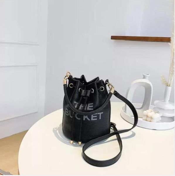 classic pull closure the marc leather bucket bag womens men handbag original luxury tote drawstring shoulder fashion designer buckets the ba
classic pull closure the marc leather bucket bag womens men handbag original luxury tote drawstring shoulder fashion designer buckets the ba