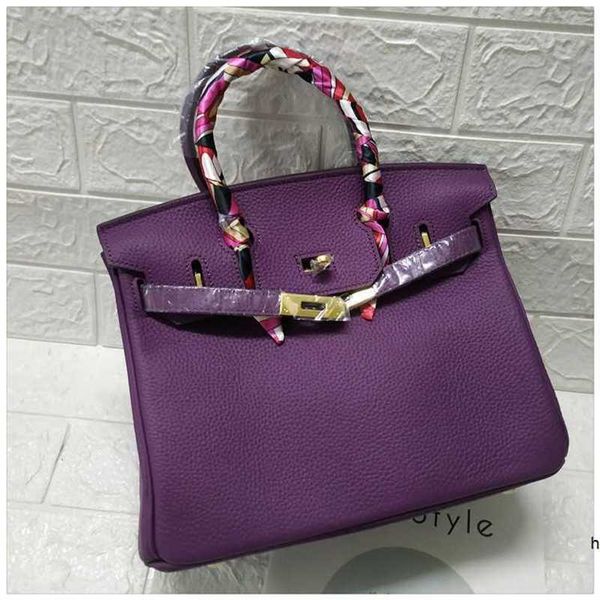 designer herms handbags litchi pattern bag fashion purple layer cow leather women's bag lock bag
designer herms handbags litchi pattern bag fashion purple layer cow leather women's bag lock bag