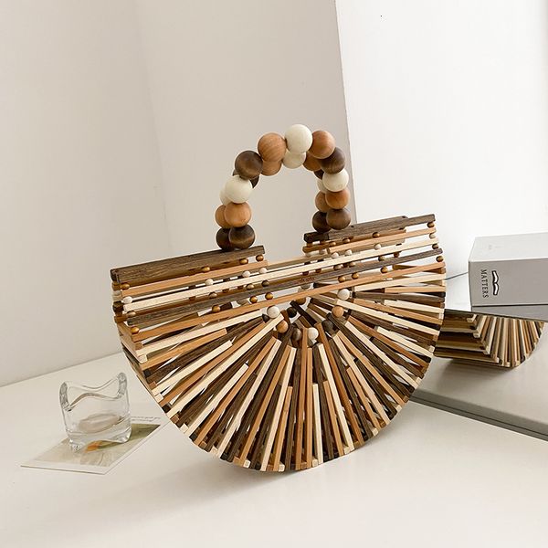 evening bags summer handmade bamboo handbag fashion wooden bead handle women's hollow out beach hand-woven travel female 230417
evening bags summer handmade bamboo handbag fashion wooden bead handle women's hollow out beach hand-woven travel female 230417