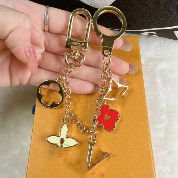 fashion brand keychain letter flower splice designer keychain metal keychain women's bag pendant car accessories, Silver
fashion brand keychain letter flower splice designer keychain metal keychain women's bag pendant car accessories, Silver