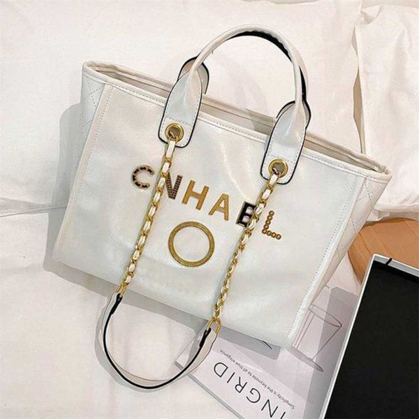 purses us sale fashion women's luxury handbags beach metal badge tote bag designer small female capacity large leather one shoulder bac
purses us sale fashion women's luxury handbags beach metal badge tote bag designer small female capacity large leather one shoulder bac