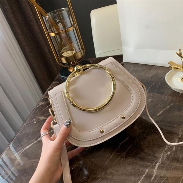 2022 genuine leather handbag bag metal ring package saddle nile handle bracelet bag female shoulder messenger crossbody283s
2022 genuine leather handbag bag metal ring package saddle nile handle bracelet bag female shoulder messenger crossbody283s