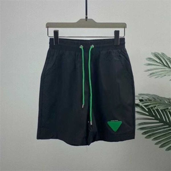 summer european station fashion triangle sign capris green loose dried beach casual men's and women's shorts, White;black
summer european station fashion triangle sign capris green loose dried beach casual men's and women's shorts, White;black