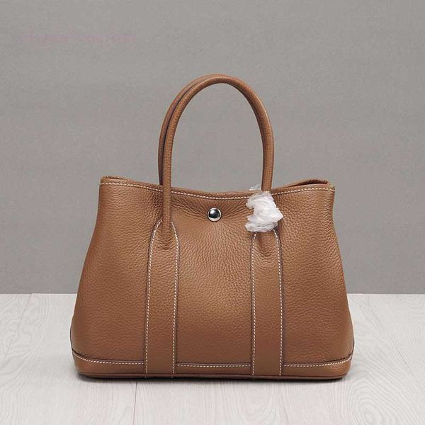 designer herbag garden party evening autumn and winter shopping lychee grain layer cowhide women's garden leather vegetable basket hand 
designer herbag garden party evening autumn and winter shopping lychee grain layer cowhide women's garden leather vegetable basket hand