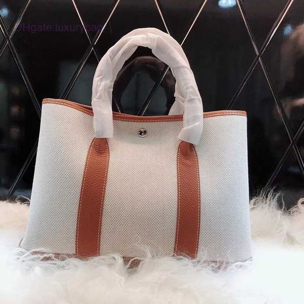 designer herbag garden party evening 2023 spring new layer cowhide colored canvas garden large capacity handheld women's bag p0f2
designer herbag garden party evening 2023 spring new layer cowhide colored canvas garden large capacity handheld women's bag p0f2