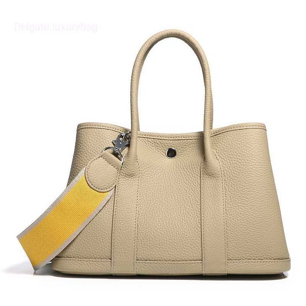 designer herbag garden party evening garden baotou cowhide lizhi pattern women's bag casual one color contrast wide shoulder belt handb
designer herbag garden party evening garden baotou cowhide lizhi pattern women's bag casual one color contrast wide shoulder belt handb