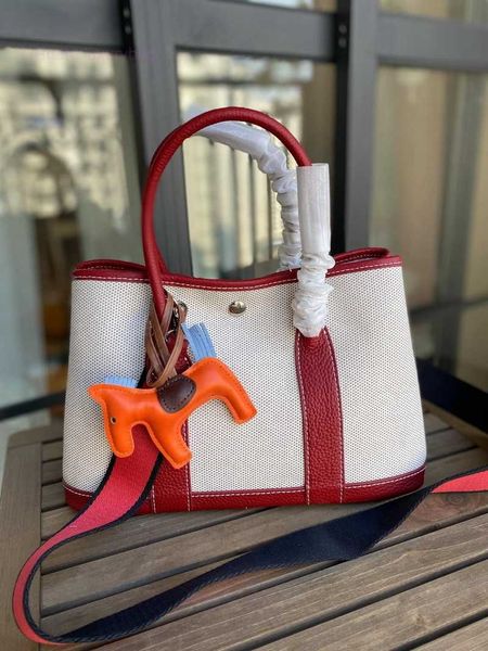 designer herbag garden party evening 2023 spring new canvas with layer cowhide garden fashion hand color contrast versatile messenger bag 14
designer herbag garden party evening 2023 spring new canvas with layer cowhide garden fashion hand color contrast versatile messenger bag 14