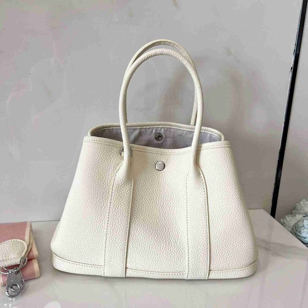 designer herbag garden party evening lychee grain layer cow leather single shoulder messenger with large capacity portable versatile women&#
designer herbag garden party evening lychee grain layer cow leather single shoulder messenger with large capacity portable versatile women&#