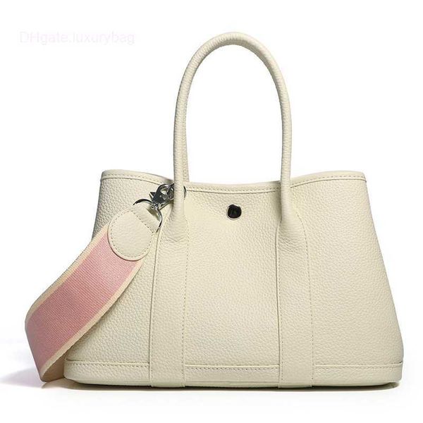 designer herbag garden party evening garden baotou cowhide lizhi pattern women's bag casual one color contrast wide shoulder belt handb
designer herbag garden party evening garden baotou cowhide lizhi pattern women's bag casual one color contrast wide shoulder belt handb
