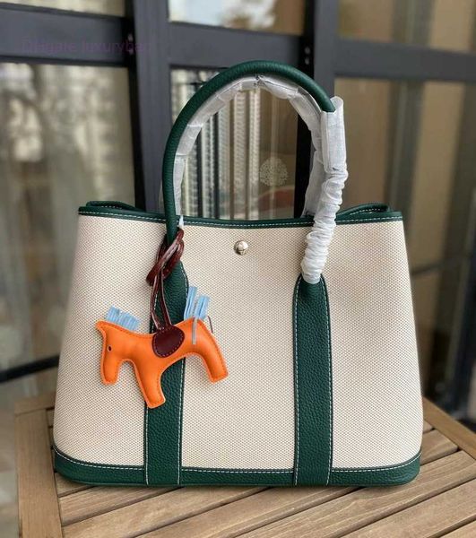 designer herbag garden party evening 2023 spring new canvas with layer cowhide garden fashion hand color contrast versatile messenger bag dd
designer herbag garden party evening 2023 spring new canvas with layer cowhide garden fashion hand color contrast versatile messenger bag dd