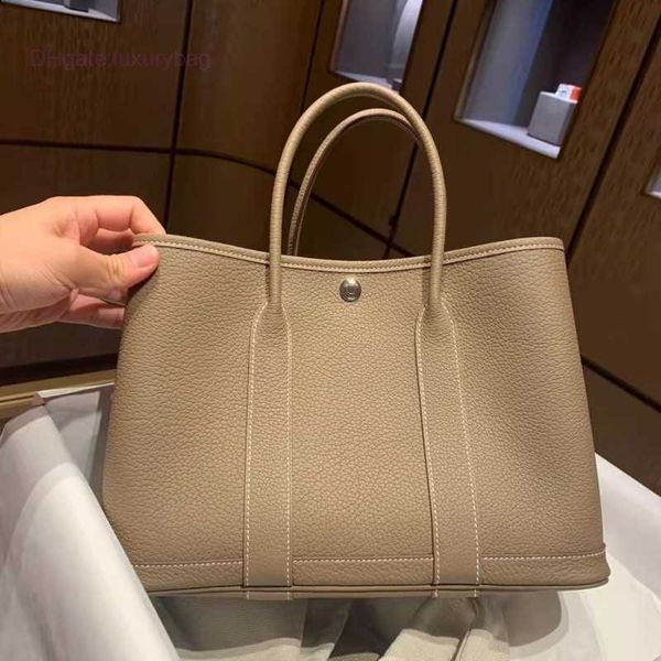 designer herbag garden party evening texture soft leather large capacity portable bucket one shoulder crossbody tote commuter women's b
designer herbag garden party evening texture soft leather large capacity portable bucket one shoulder crossbody tote commuter women's b