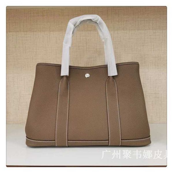 designer herbag garden party evening high end garden layer cowhide leather portable women's bucket large capacity shopping mother bag 4
designer herbag garden party evening high end garden layer cowhide leather portable women's bucket large capacity shopping mother bag 4