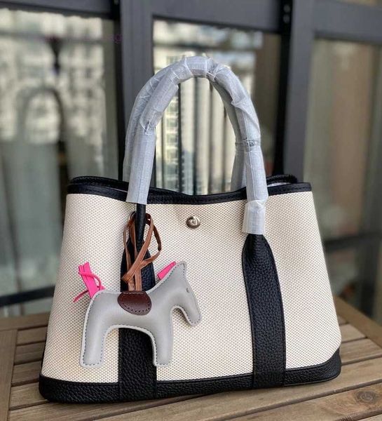 designer herbag garden party evening 2023 spring new canvas with layer cowhide garden fashion hand color contrast versatile messenger bag 0v
designer herbag garden party evening 2023 spring new canvas with layer cowhide garden fashion hand color contrast versatile messenger bag 0v