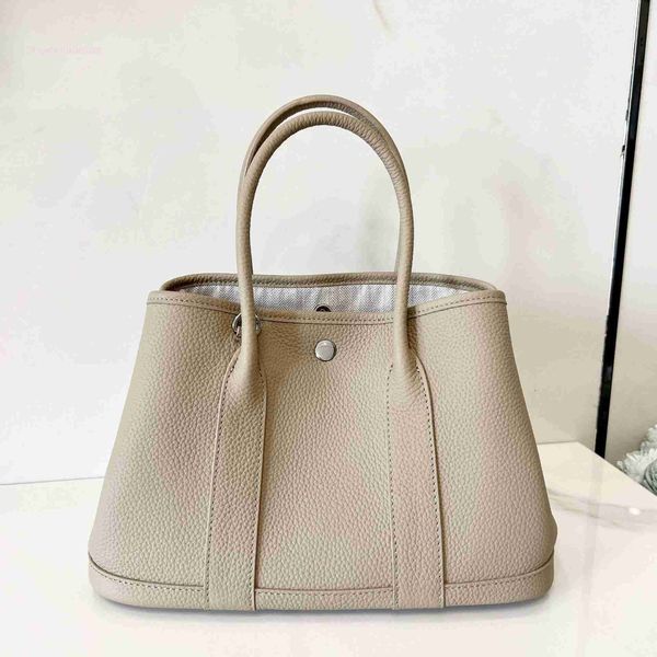 designer herbag garden party evening lychee grain layer cow leather single shoulder messenger with large capacity portable versatile women&#
designer herbag garden party evening lychee grain layer cow leather single shoulder messenger with large capacity portable versatile women&#