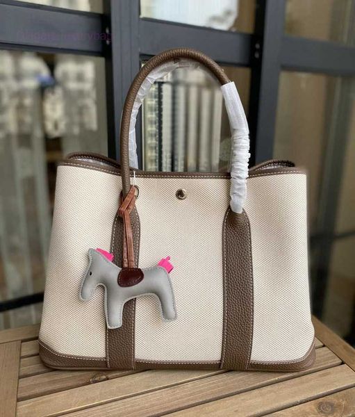 designer herbag garden party evening 2023 spring new canvas with layer cowhide garden fashion hand color contrast versatile messenger bag ee
designer herbag garden party evening 2023 spring new canvas with layer cowhide garden fashion hand color contrast versatile messenger bag ee