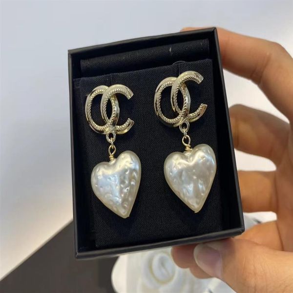 white pearl heart charm earrings bright copper material personalized shape brand fashion classic luxury earrings designer for w1859, Golden
white pearl heart charm earrings bright copper material personalized shape brand fashion classic luxury earrings designer for w1859, Golden