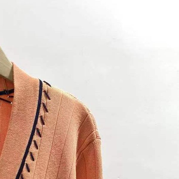 sweaters 2022 early spring new vneck handhooked orange sweet knitted cardigan and skirt, White;black
sweaters 2022 early spring new vneck handhooked orange sweet knitted cardigan and skirt, White;black
