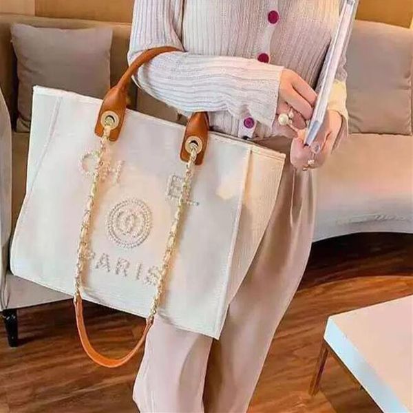 new designer shopping bags handbags pearl beach bag canvas portable high-capacity fashion trend women bag c230225313n
new designer shopping bags handbags pearl beach bag canvas portable high-capacity fashion trend women bag c230225313n