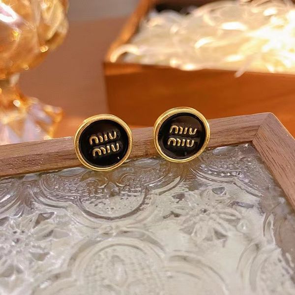 925 silver needle small round miu letter earrings for women's light luxury and small design sense high grade red enamel vintage earring, Golden;silver
925 silver needle small round miu letter earrings for women's light luxury and small design sense high grade red enamel vintage earring, Golden;silver