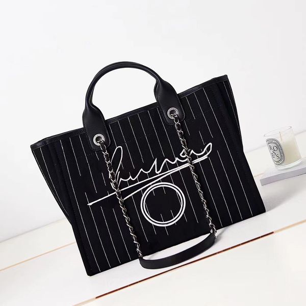 10a luxury tote bag brand fashion women's tote bag striped large capacity canvas one shoulder bag portable beach bag
10a luxury tote bag brand fashion women's tote bag striped large capacity canvas one shoulder bag portable beach bag