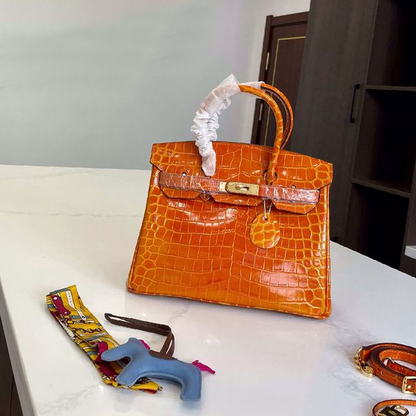 crocodile pattern handbag tote bags crossbody bag cowhide leather long strap golden hardware bottom nail golden hardware key lock 30cm
crocodile pattern handbag tote bags crossbody bag cowhide leather long strap golden hardware bottom nail golden hardware key lock 30cm