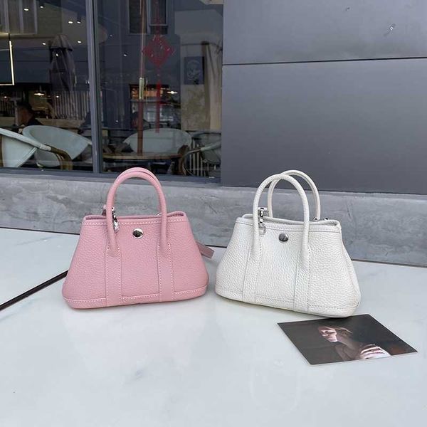 garden party designer totes 2023 new pink small bag single shoulder oblique straddle handbag litchi pattern fashion casual ribbon tote bag
garden party designer totes 2023 new pink small bag single shoulder oblique straddle handbag litchi pattern fashion casual ribbon tote bag