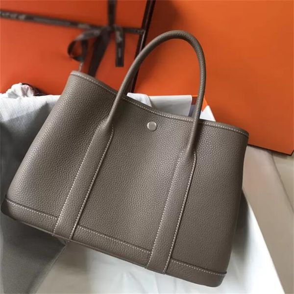 7a designer bags garden party handbag hogh quality large capacity shopping bag fashion classic handmade togo leather women's genuine le
7a designer bags garden party handbag hogh quality large capacity shopping bag fashion classic handmade togo leather women's genuine le