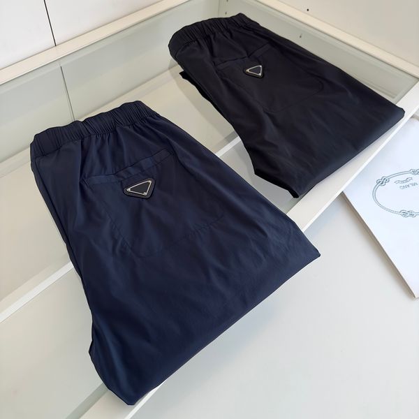 2023 spring and summer designer luxury sports pants men's pants metal triangle cool thin casual lace-up jogging pants, Black
2023 spring and summer designer luxury sports pants men's pants metal triangle cool thin casual lace-up jogging pants, Black
