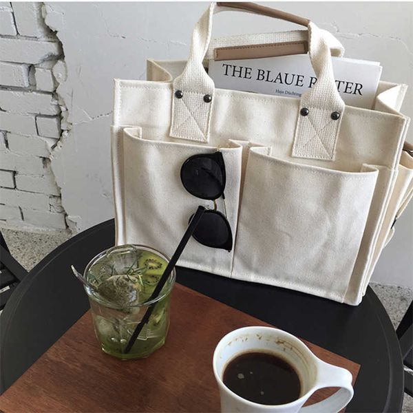 evening bags canvas simple totes with many pockets messenger bags large capacity shoulder bag female big handbag g230208
evening bags canvas simple totes with many pockets messenger bags large capacity shoulder bag female big handbag g230208