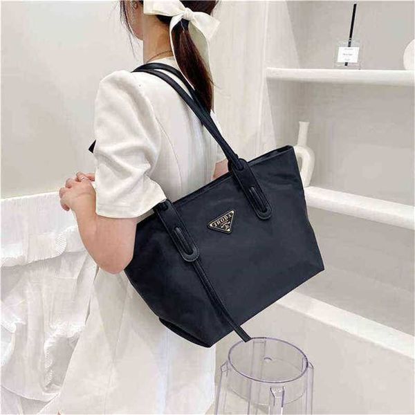26% off handbag 2023 new bag triangle classic canvas shoulder large capacity tote shopping nylon portable
26% off handbag 2023 new bag triangle classic canvas shoulder large capacity tote shopping nylon portable