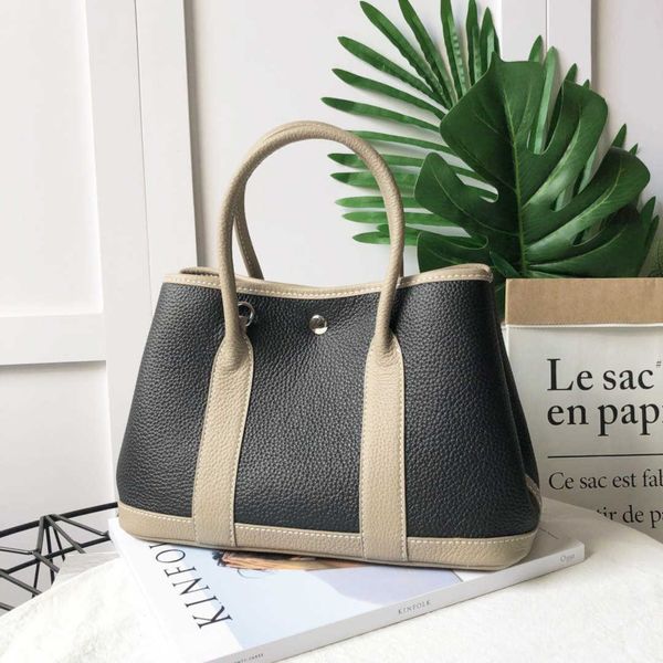 herme garden party handbags price contrast color garden wide shoulder strap women's leather lychee pattern han
herme garden party handbags price contrast color garden wide shoulder strap women's leather lychee pattern han