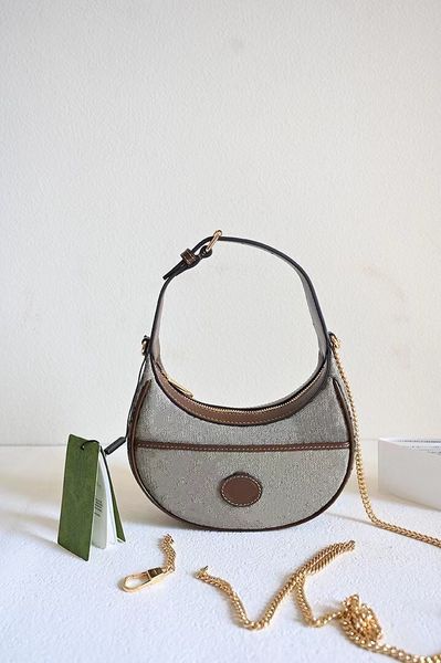 vintage half moon ophidia mini bag 726843 shoulder bags brown canvas crescent shaped handbag with a leather strap and gold chain under arm
vintage half moon ophidia mini bag 726843 shoulder bags brown canvas crescent shaped handbag with a leather strap and gold chain under arm