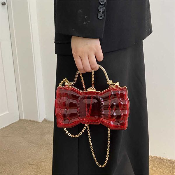 bowknot shape acrylic box jelly bag small and delicate clear pvc women handbags mini designer evening crossbody tote bags
bowknot shape acrylic box jelly bag small and delicate clear pvc women handbags mini designer evening crossbody tote bags