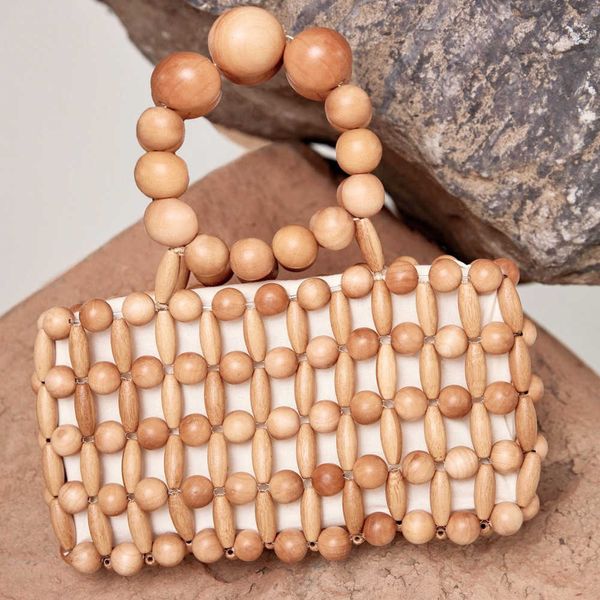 women's handbag wooden beads handmade bag mini female vintage bamboo hollow summer beach holiday girls purses 2022 220625
women's handbag wooden beads handmade bag mini female vintage bamboo hollow summer beach holiday girls purses 2022 220625