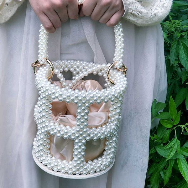handmade beaded bucket bag hollow round women's handbag imitation pearl net red bag 230220
handmade beaded bucket bag hollow round women's handbag imitation pearl net red bag 230220