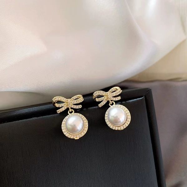 super fairy pearl bow charm earrings trendy net red personality versatile flash diamond earrings sweet temperament high sense, Golden
super fairy pearl bow charm earrings trendy net red personality versatile flash diamond earrings sweet temperament high sense, Golden