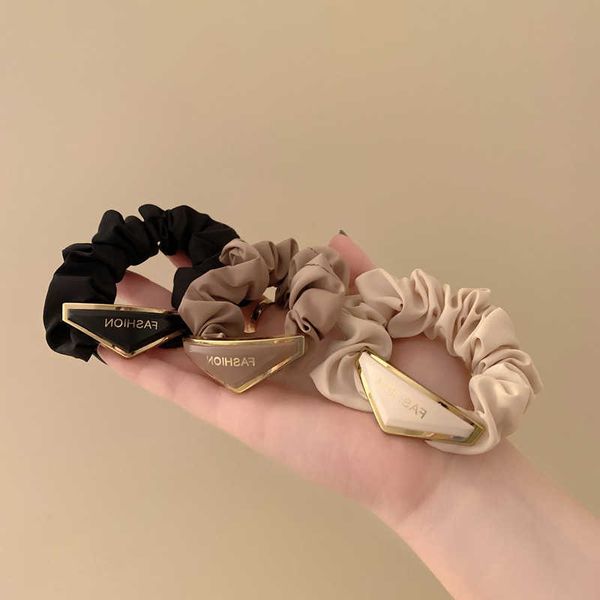 hair clips barrettes ins selling triangle word metal head rope hair ties for woman retro satin elastic scrunchies wholesale j230221, Golden;silver
hair clips barrettes ins selling triangle word metal head rope hair ties for woman retro satin elastic scrunchies wholesale j230221, Golden;silver