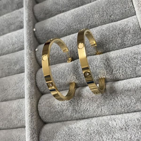 mixed style women designer studs 3 colors titanium steel fashion couple earrings logo printed, Golden;silver
mixed style women designer studs 3 colors titanium steel fashion couple earrings logo printed, Golden;silver