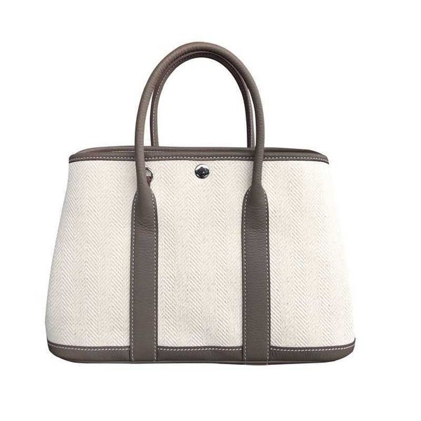 h gardens grace bag 2023 new layer cowhide togo garden with canvas 30 high grade shopping tote women's hand with real logo
h gardens grace bag 2023 new layer cowhide togo garden with canvas 30 high grade shopping tote women's hand with real logo
