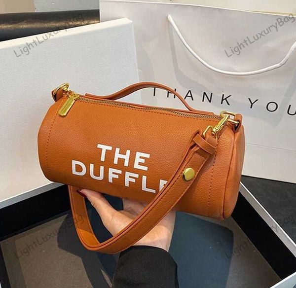 luxury brand designer the duffle bag summer round bucket handbag m korean version j crossbody bags with wide straps and large letters 230605
luxury brand designer the duffle bag summer round bucket handbag m korean version j crossbody bags with wide straps and large letters 230605