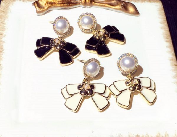 new trendy fashion luxury designer diamond pearl bow sweet cute pendant stud earrings for women girls with sterling silver post stunning chi, Golden;silver
new trendy fashion luxury designer diamond pearl bow sweet cute pendant stud earrings for women girls with sterling silver post stunning chi, Golden;silver